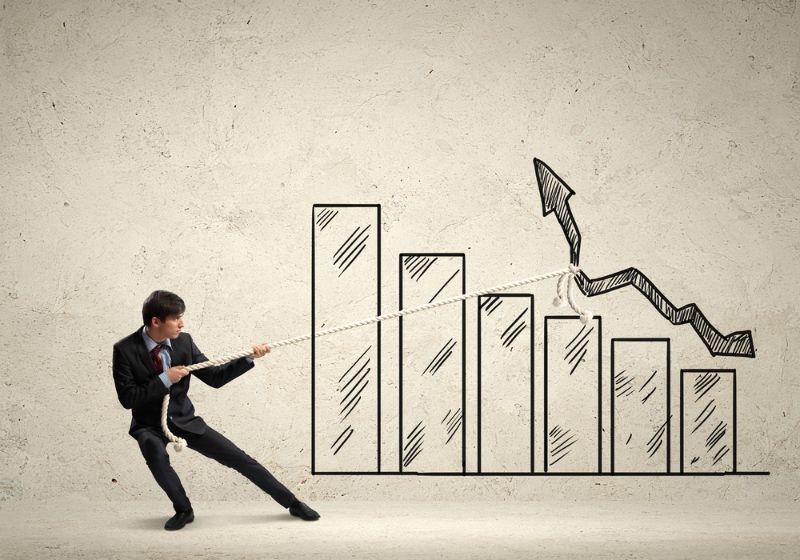 Image of young businessman pulling graph. Chart growth concept-1